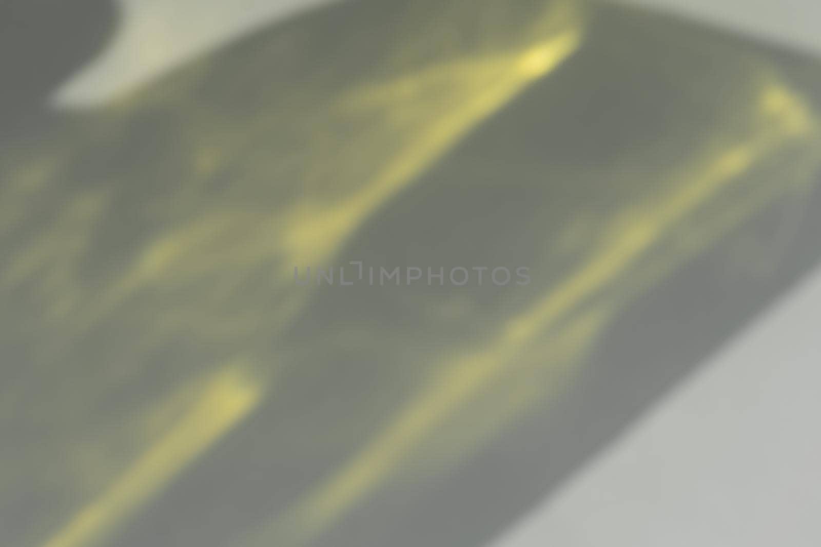 Caustic effect light refraction on yellow wall overlay , blurred sun rays refracting through glass prism with shadow. Abstract natural light refraction silhouette on water surface.