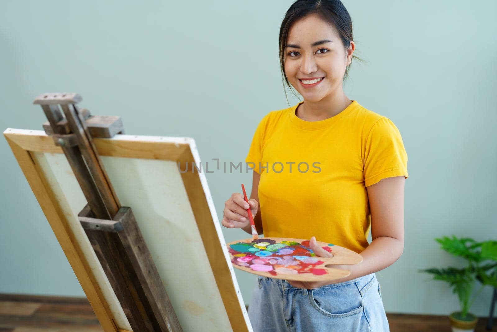 Portrait of an Asian woman designing art in her spare time