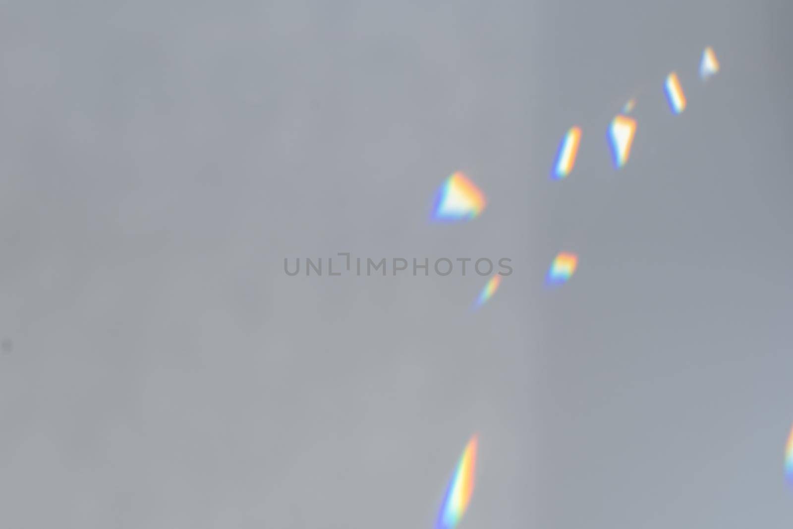 .Crystal light reflections for overlay mockup on light background. Rainbow holographic shadow mock up, iridescent prismatic wallpaper. Abstract prism reflection, rays leaking through lens effect.