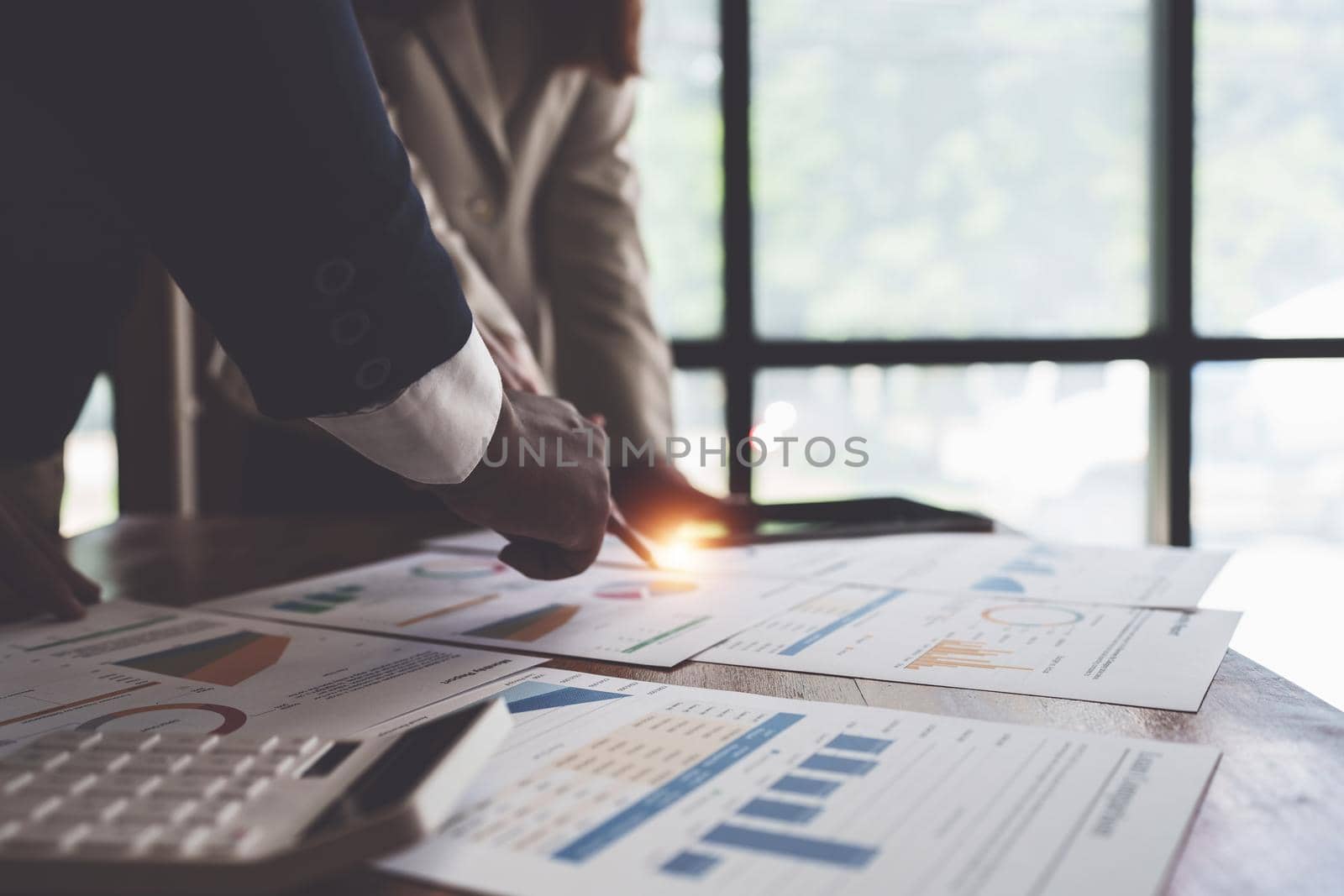 Fund managers team consultation and discuss about analysis Investment stock market by digital tablet