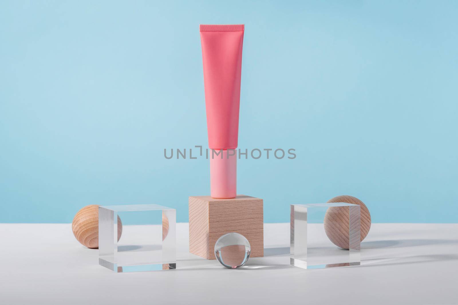 Medical skincare and cosmetic cream mockup on acrylic block pedestal podium with stylish props, glass balls. Lotion, concealer beauty product packaging. Product presentation mock up