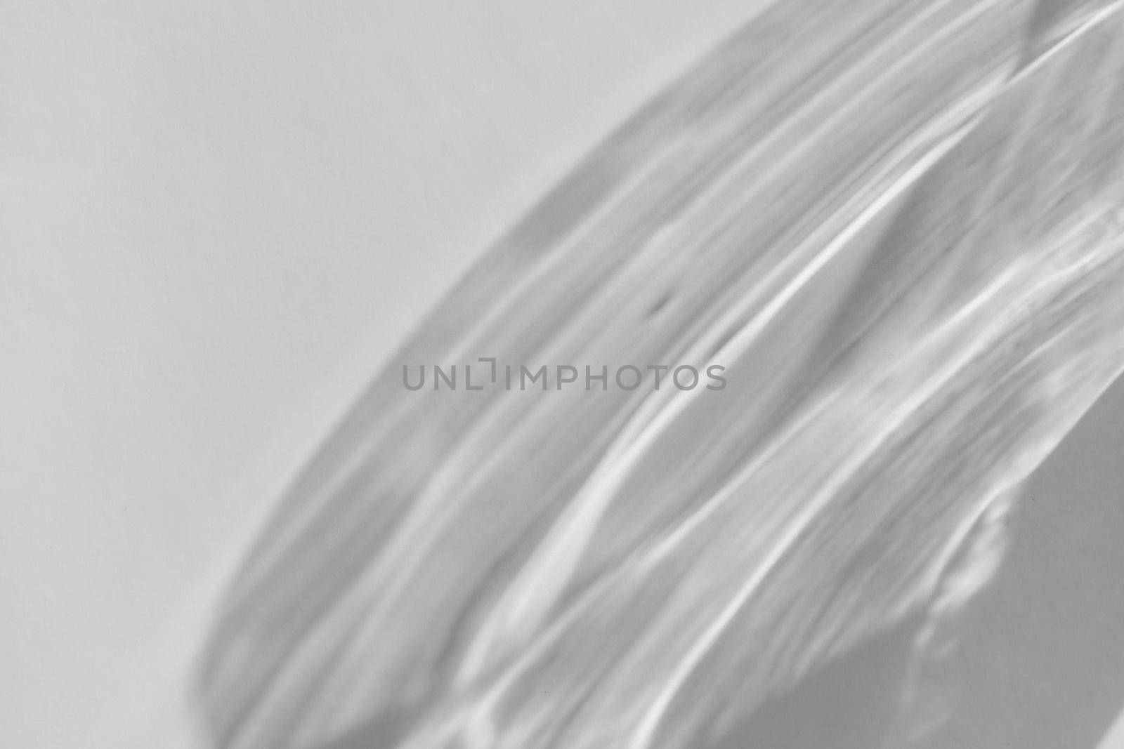 Shadow and light refraction on white wall overlay photo effect, sun rays refracting through glass and prism, blurred caustic effects. Natural light refraction silhouette on blank surface. by photolime