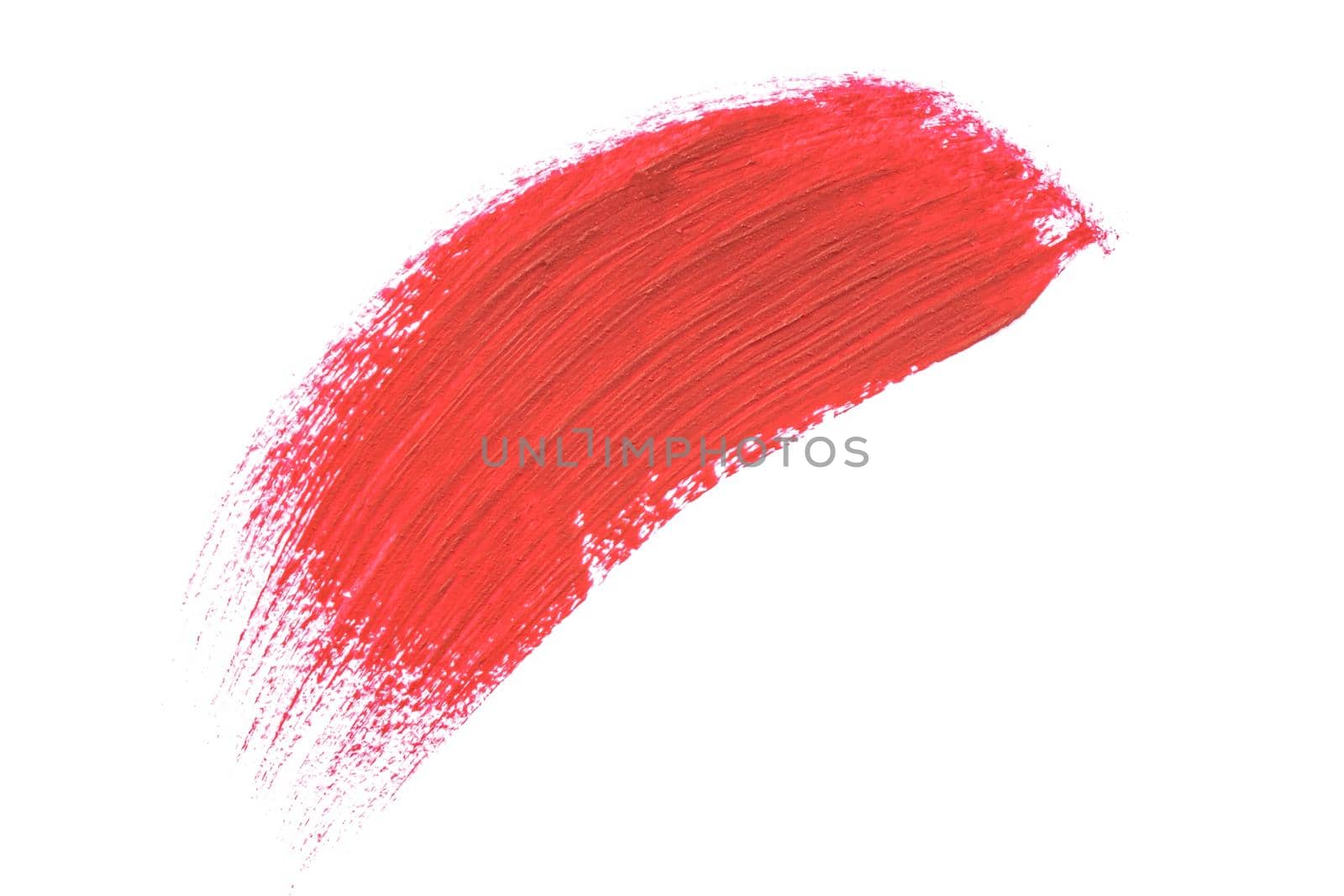 Red smudged lipstick stroke sample isolated on white background. Beauty face make up, close up. Makeup creamy texture. Beauty product smudge closeup. Liquid beauty cosmetics