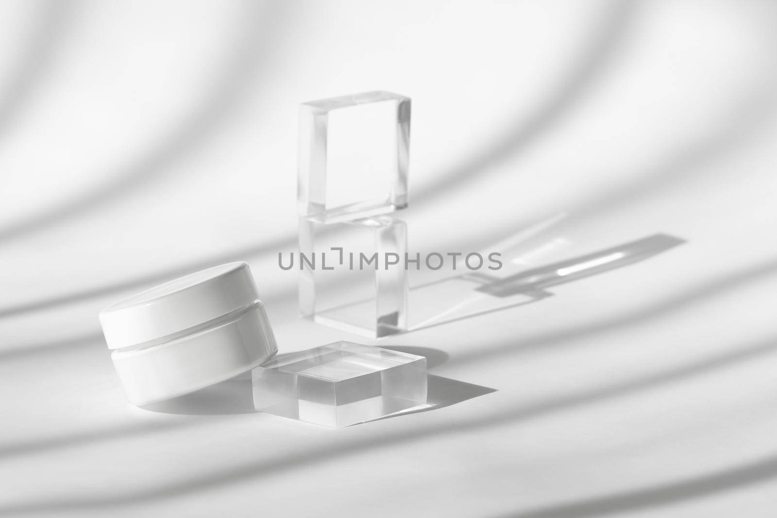 Cream lotion pot cosmetics showcase presentation mockup on white. White creme cosmetic jar on acrylic geometric pedestal podium block, beauty product packaging with shadows by photolime