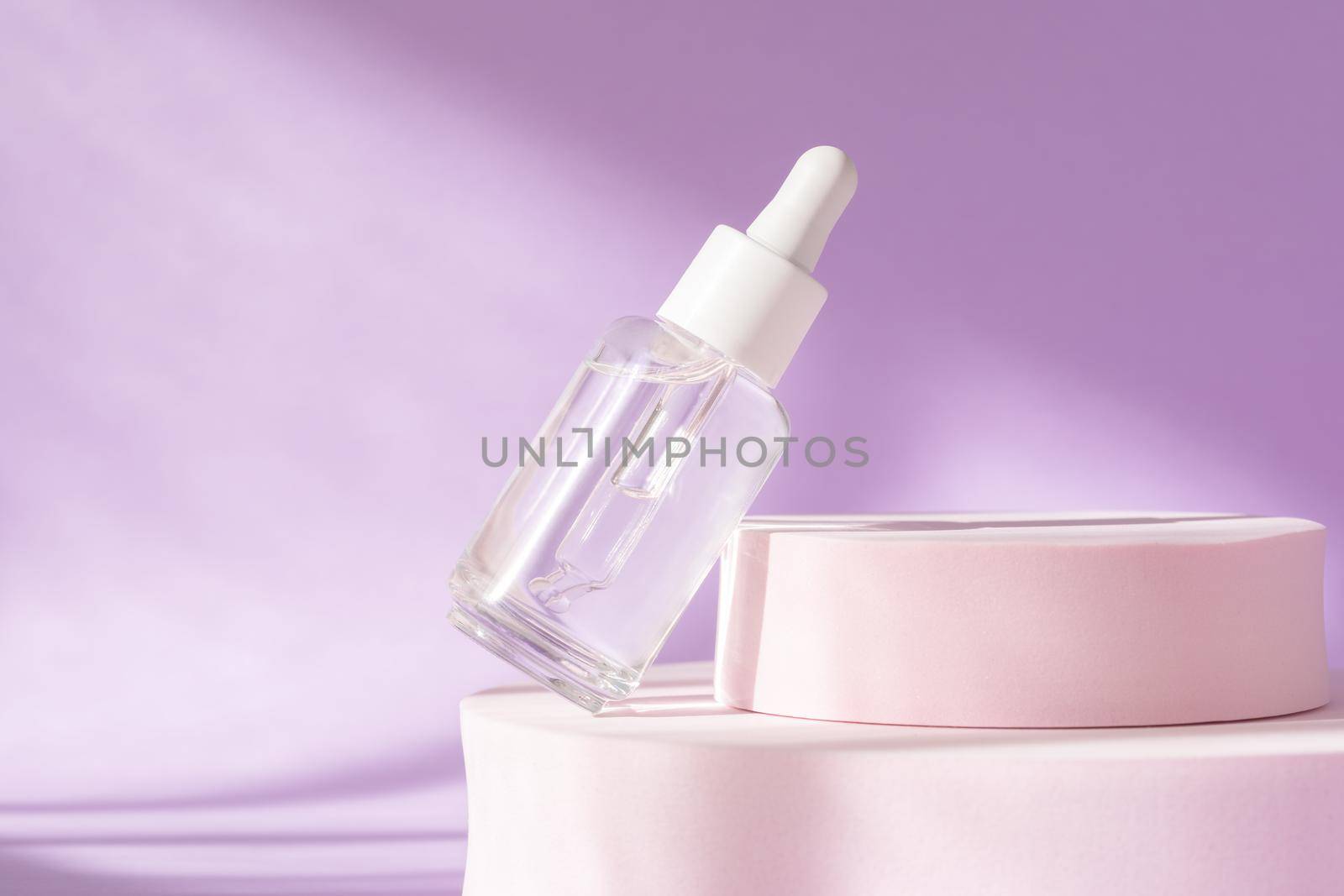 Hyaluronic acid, serum skincare glass bottle on lilac pink podium pedestal. Serum product cosmetic with peptide and collagen. Modern brand cosmetics packaging with shadow. Cosmetic showcase