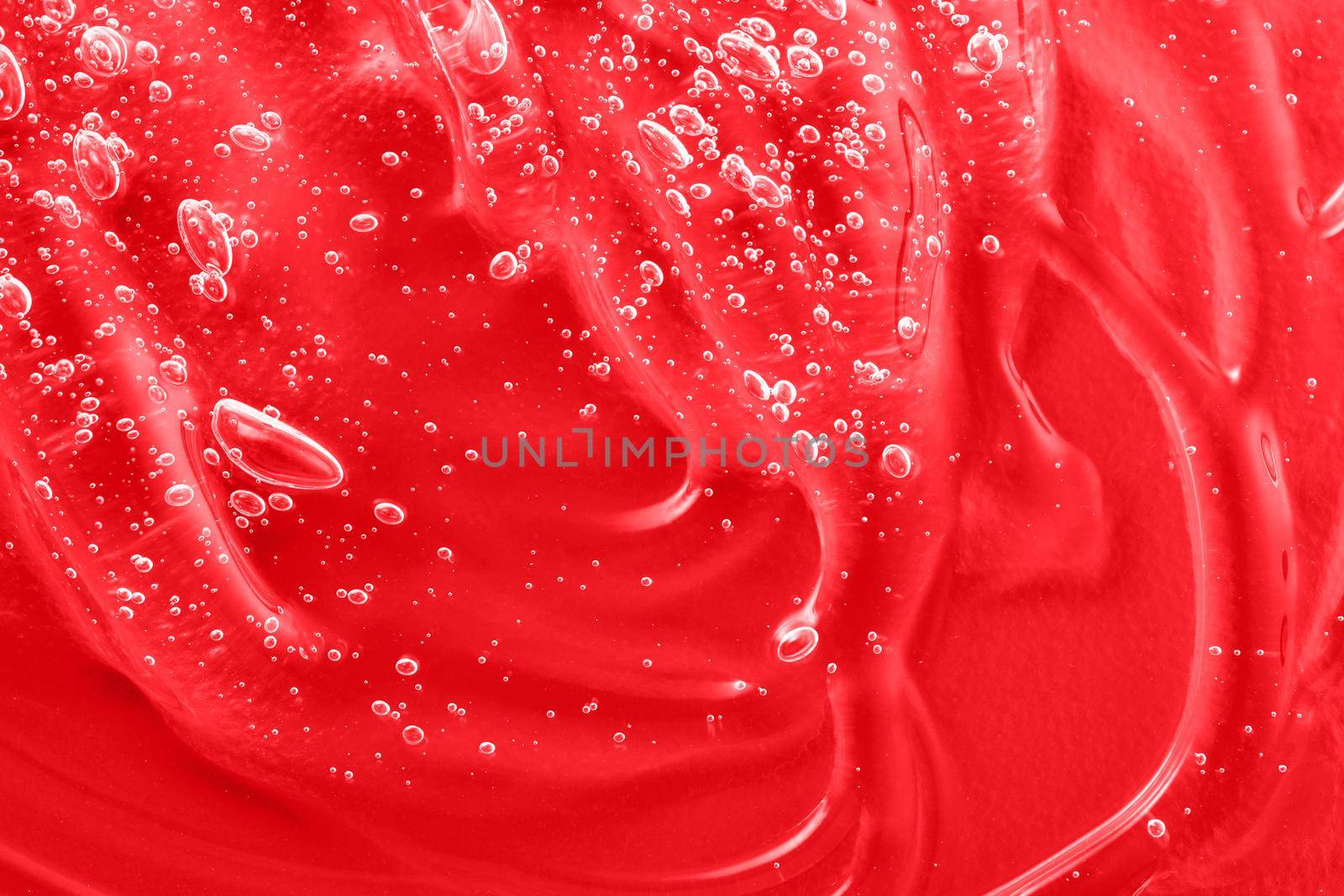 Serum liquid cosmetics, jelly cosmetic product. Hyaluronic acid toner swatch. Transparent cream sample smudge with collagen and vitamin. Red moisturizer smear. Gel texture with bubbles. Closeup by photolime