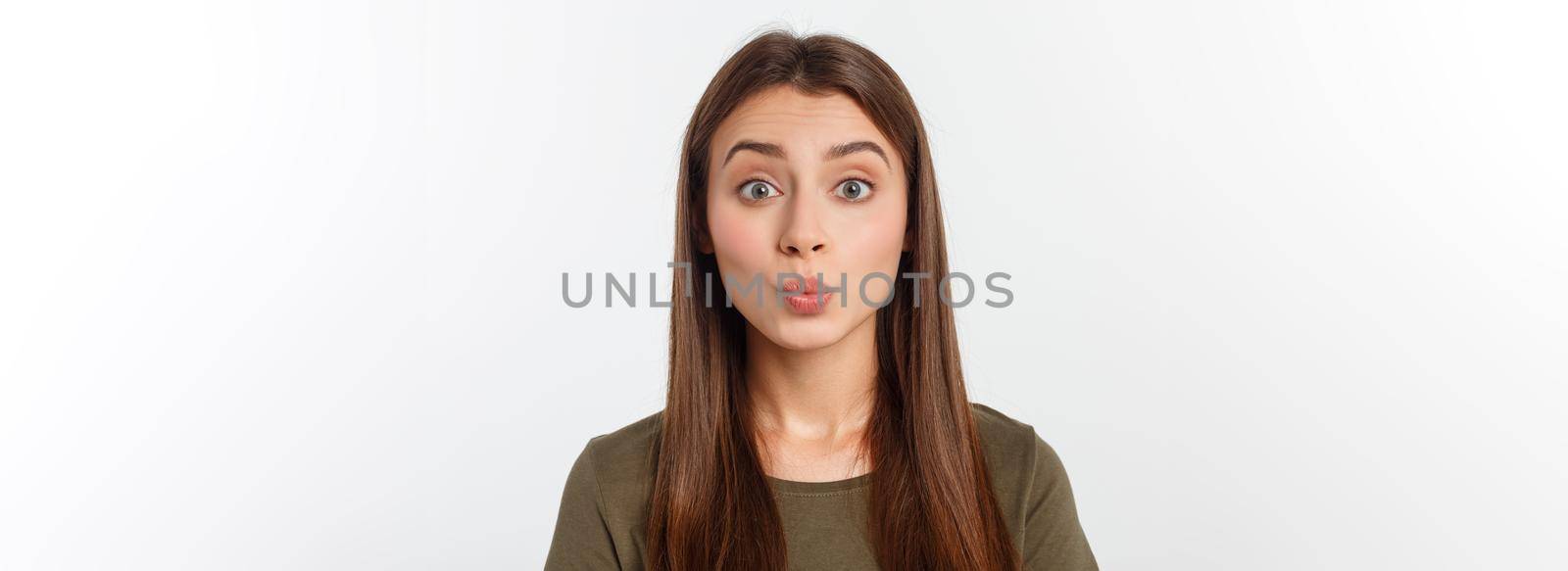 Portrait joyful outgoing woman likes laugh out loud not hiding emotions giggling chuckling facepalm close eyes smiling broadly white background.