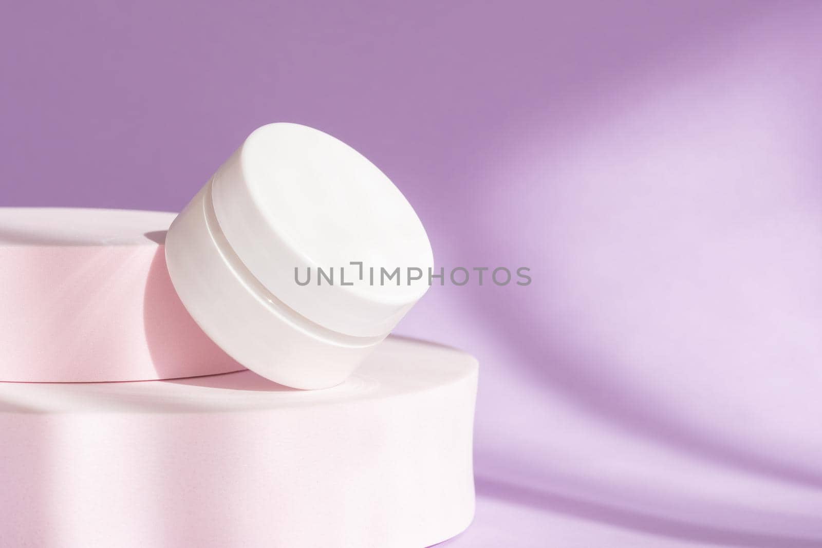 White package creme container on pedestal and shadow background. Blank skin care product template, luxury skincare body moisturizer bottle. Beauty cosmetic cream jar mockup on purple podium by photolime