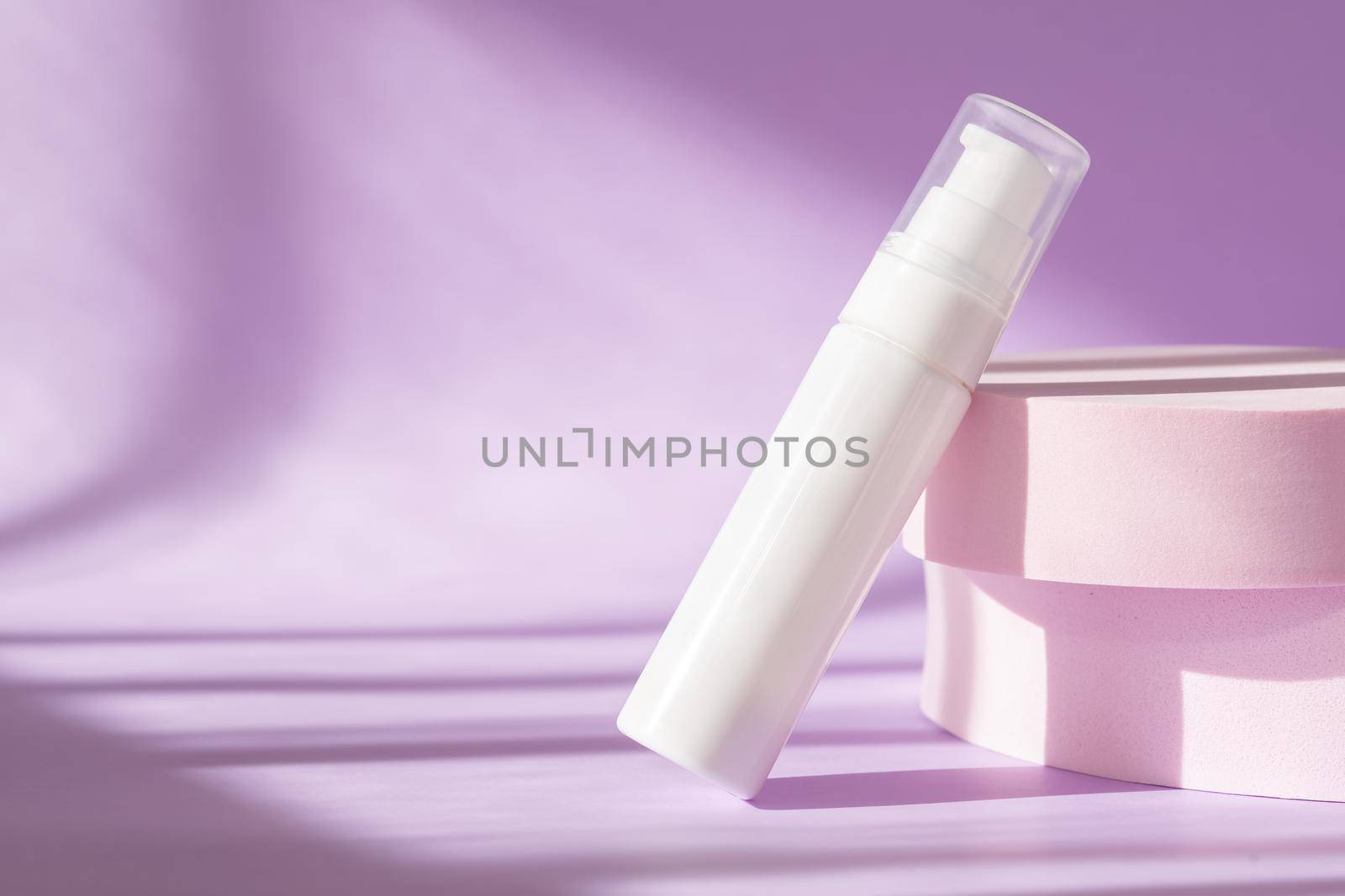 Beauty treatment medical skincare and cosmetic lotion cream serum oil mockup bottle packaging product on pink background. Modern product presentation with podium, sunlight, shadow with natural light.