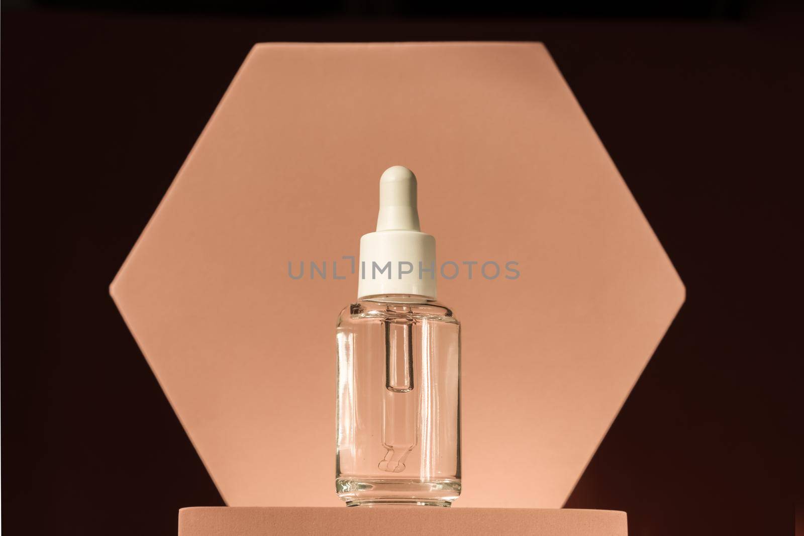 Serum product cosmetic with peptide and collagen on brown surface. Hyaluronic acid, serum skincare bottle on beige podium pedestal. Modern brand packaging with shadows by photolime