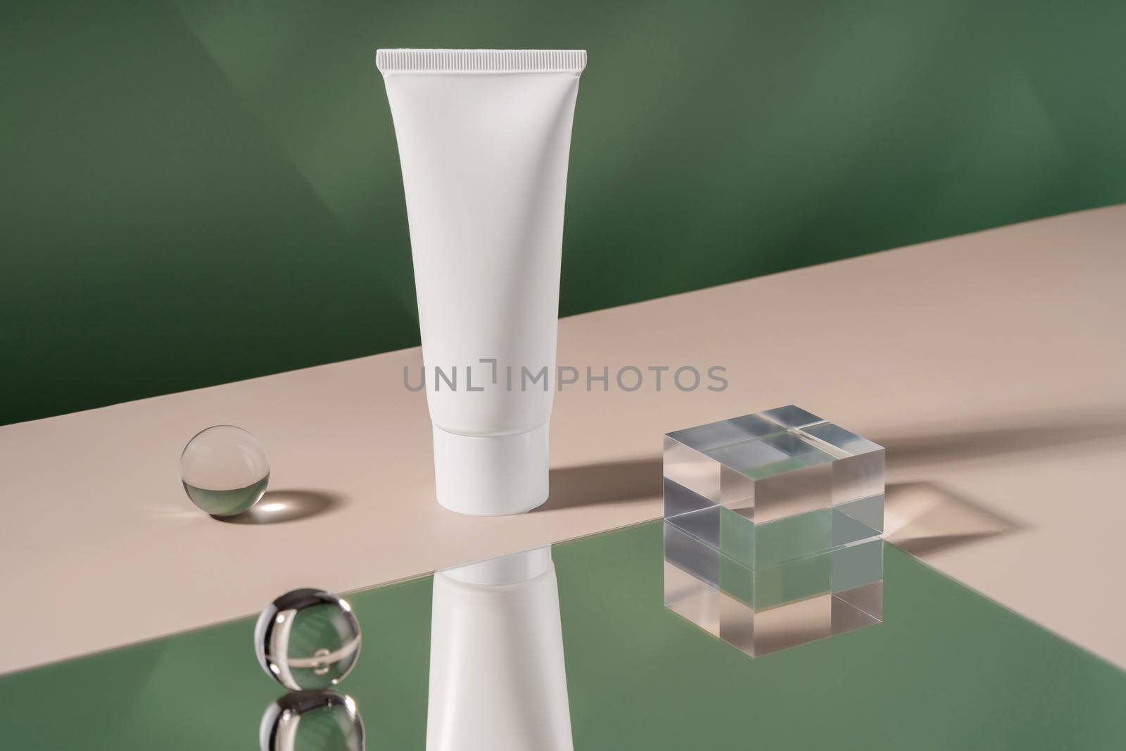 Showcase cosmetics mock up for advertising, cosmetics stand, branding scene with ball and mirror, shadow light. Cosmetic cream mockup showcase product presentation. Green backdrop with stylish props