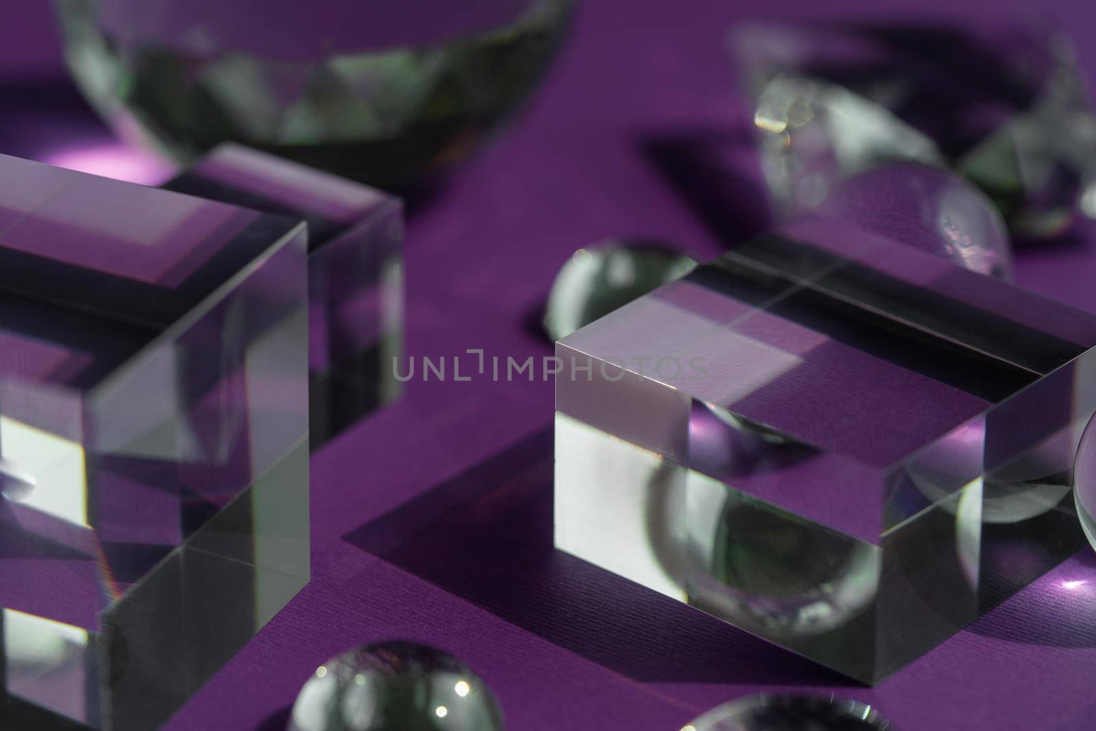 Crystal prism refracting light, magic crystals and pyramid, sphere and cube on purple background. Spiritual healing crystal practice. Feng Shui, good energy flow concept background.. by photolime