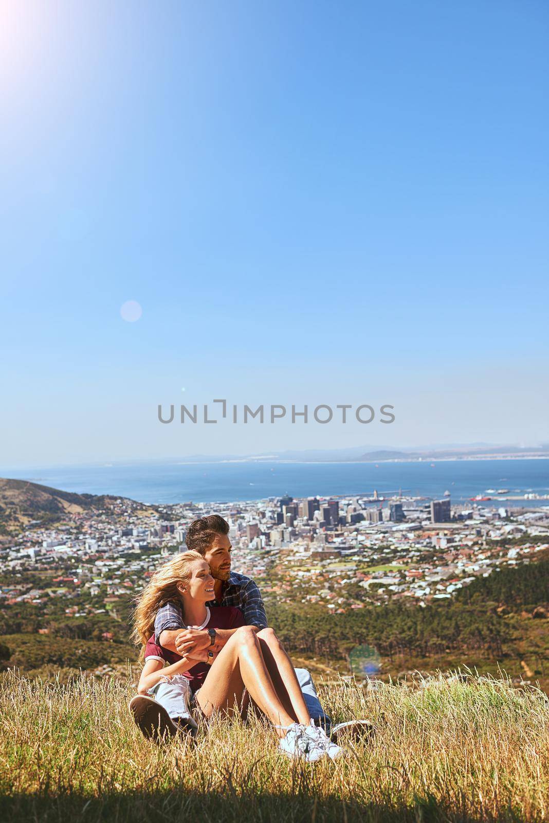 They found love in the wilderness. an affectionate young couple enjoying a day outdoors. by YuriArcurs