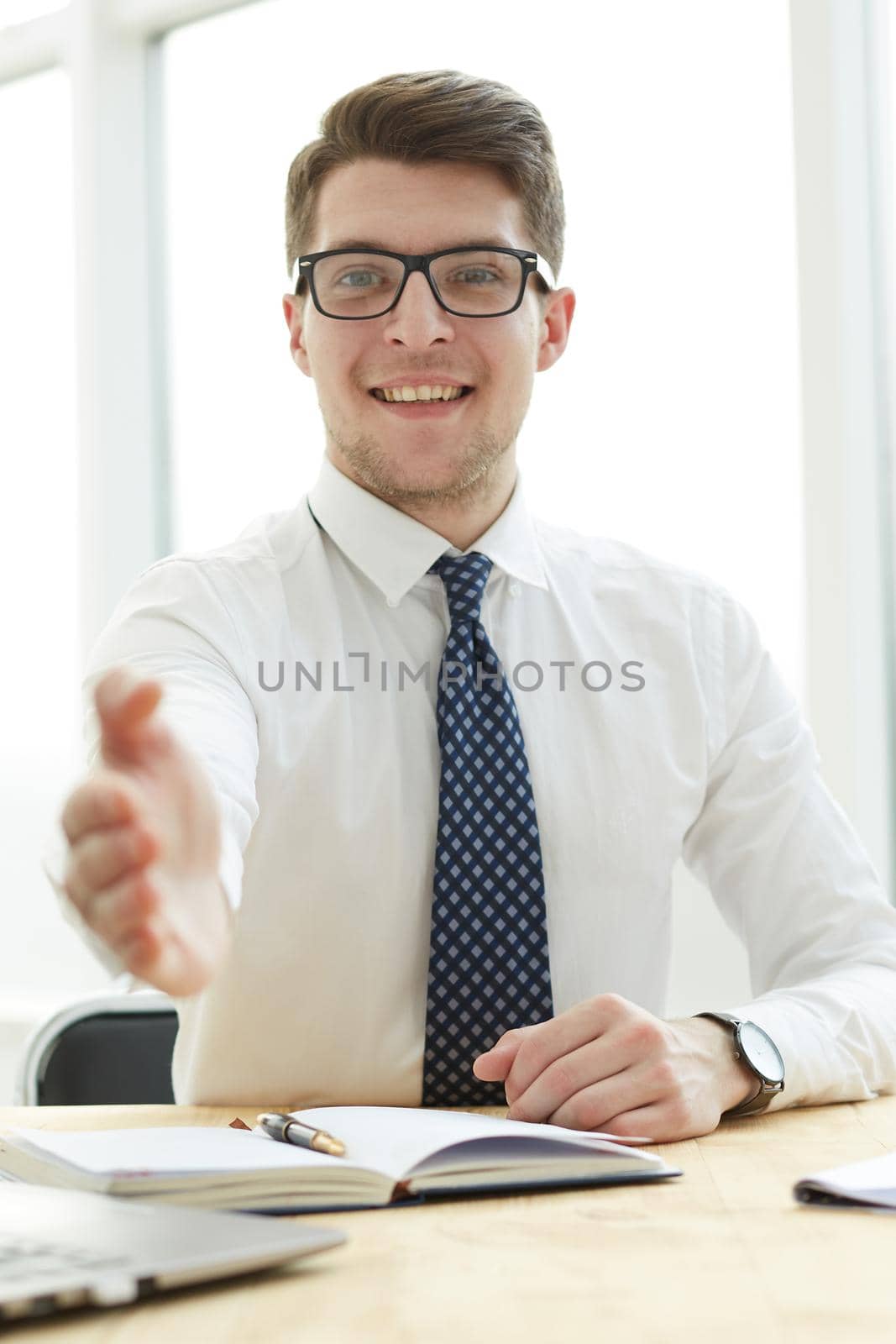 Businessman extending hand to shake by Prosto