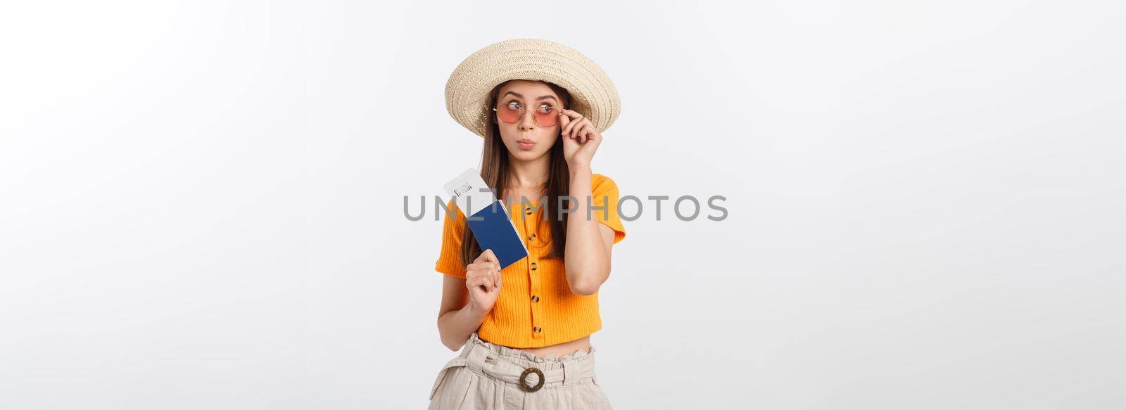 Portrait of happy tourist woman holding passport on holiday on white background