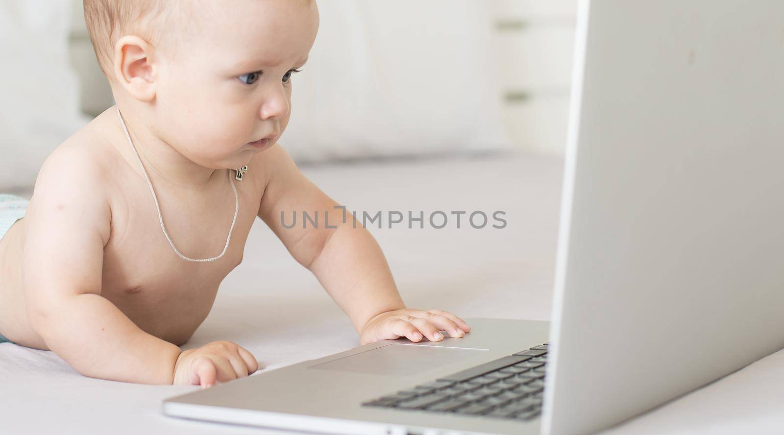 A baby and a computer, head shot laptop by Andelov13