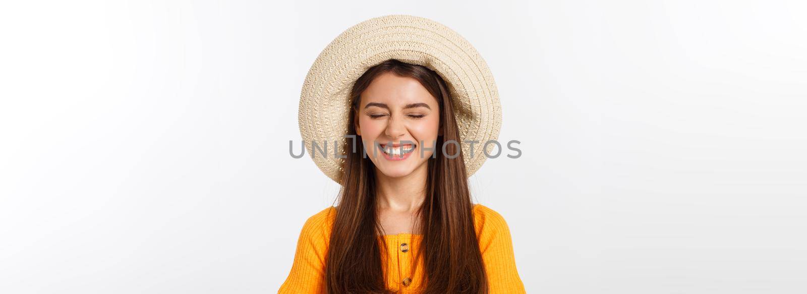 Attractive happy woman preparing for summer vacation on white