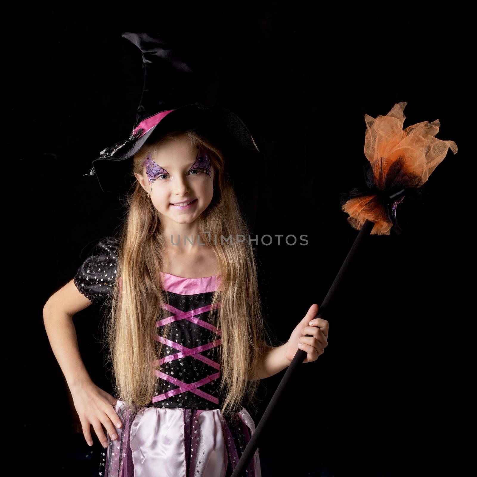 Cute halloween witch girl in fantasy costume, positive character, isolated on black background