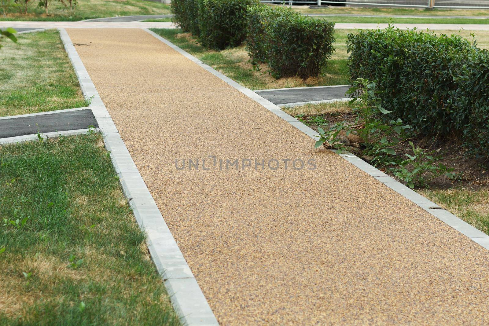 Small pebble road. Sidewalk pavement. by lara29