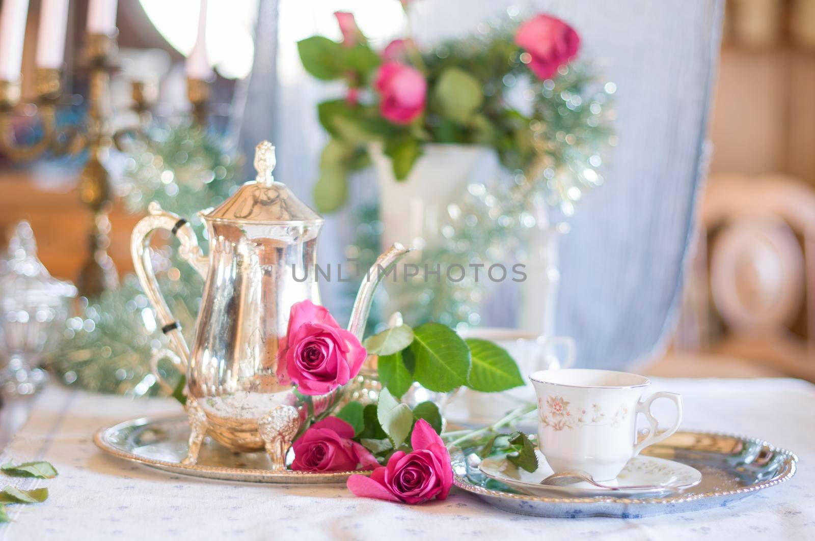 Tea break in English style, vintage silver service against the background of New Year's decor, festive still life, shallow depth of field, light and air