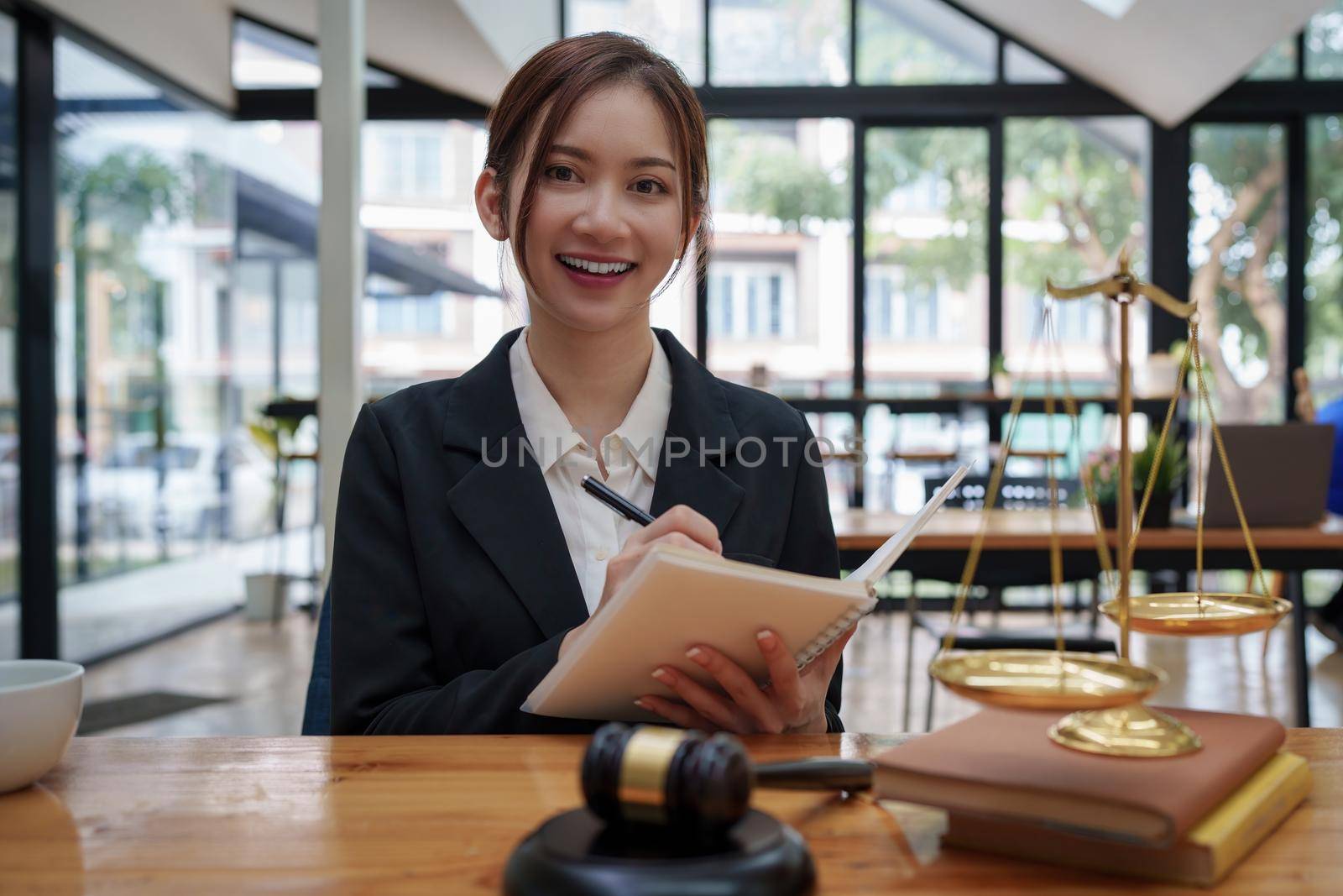 Lawyer business woman working or reading lawbook in office workplace for consultant lawyer concept.