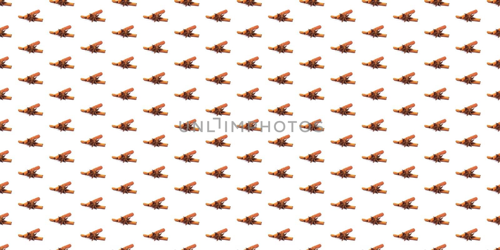 cinnamon sticks and star anise on white background. spices superfood isolate. tubes from the bark of a tree Cinnamon. spices for mulled wine. seamless pattern, wrapping wallpaper. High quality photo