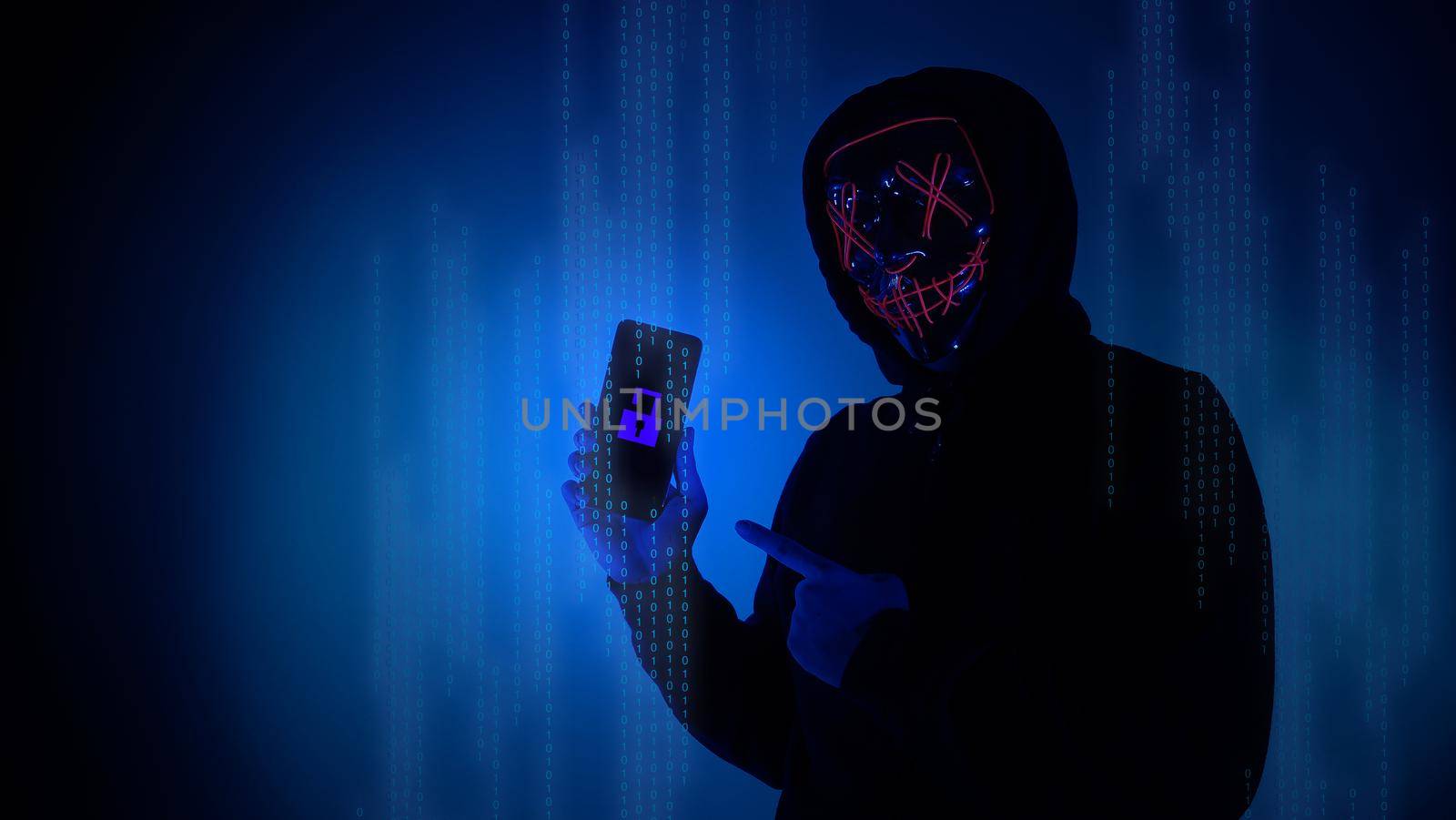 Digital security Concept. Anonymous hacker with mask holding smartphone hacked. by gnepphoto