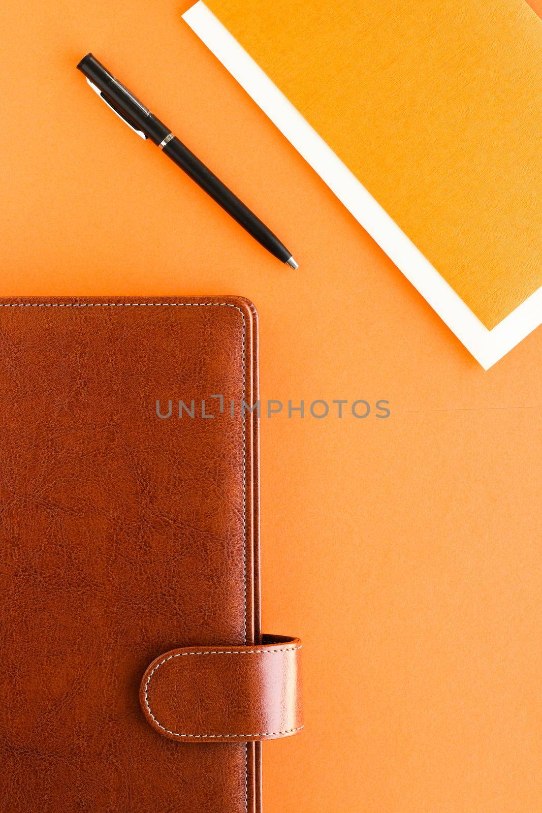 Luxury business brown brief-case on the office table desk, flatlay by Anneleven