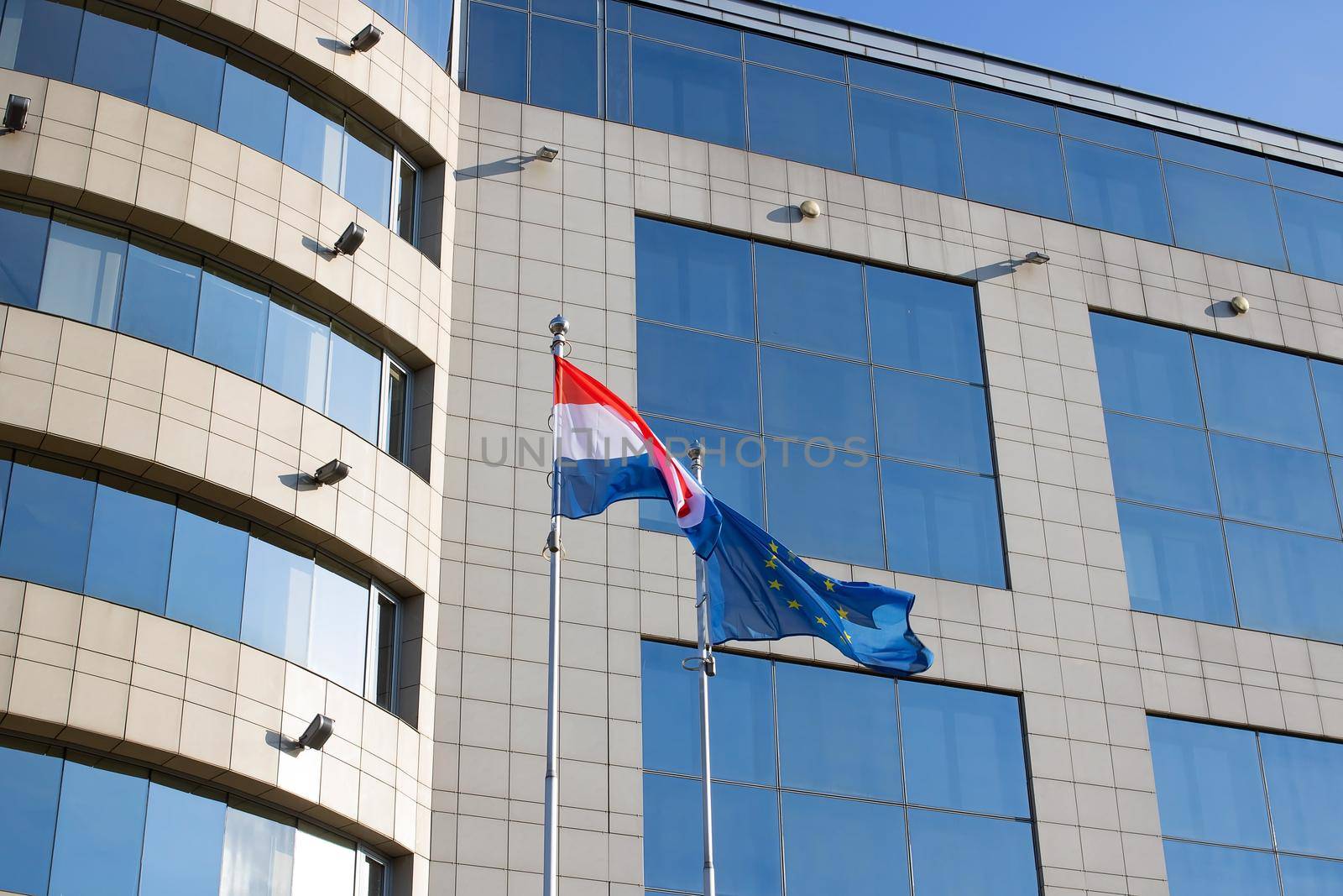 Belarus, Minsk - 18 august, 2022: Flags of the EU and the Netherlands at the office building