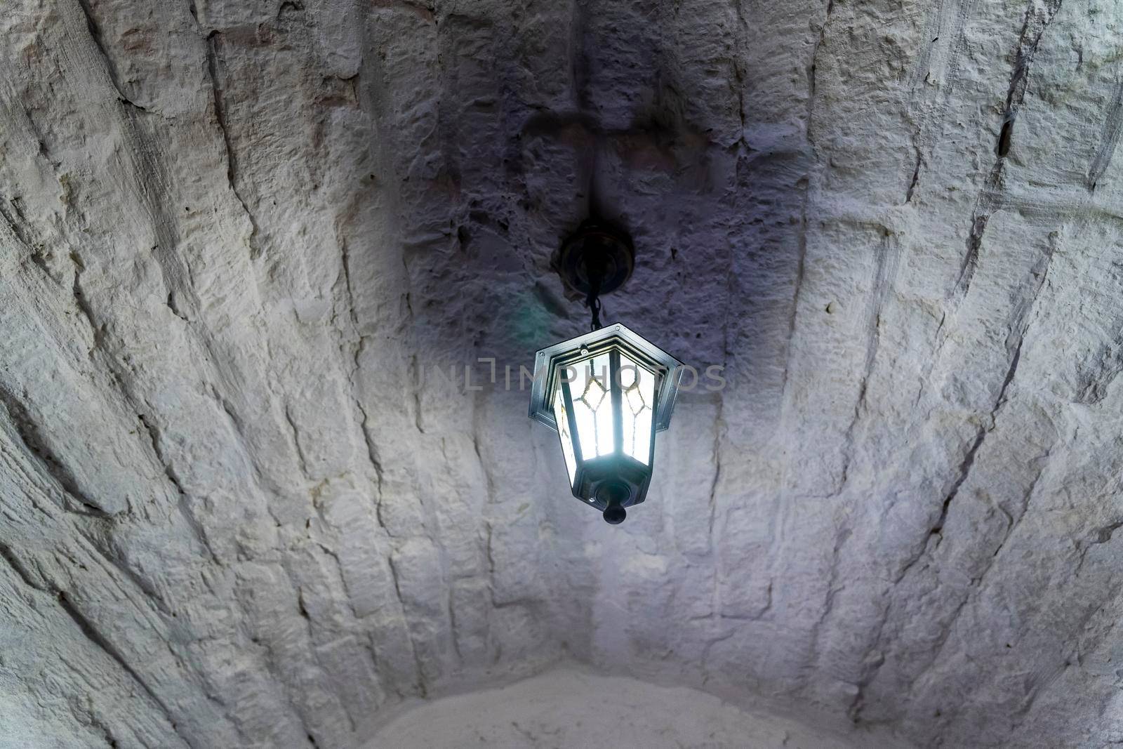 Vintage lantern hanging under the brick arch in the restaurant. Decor by audiznam2609