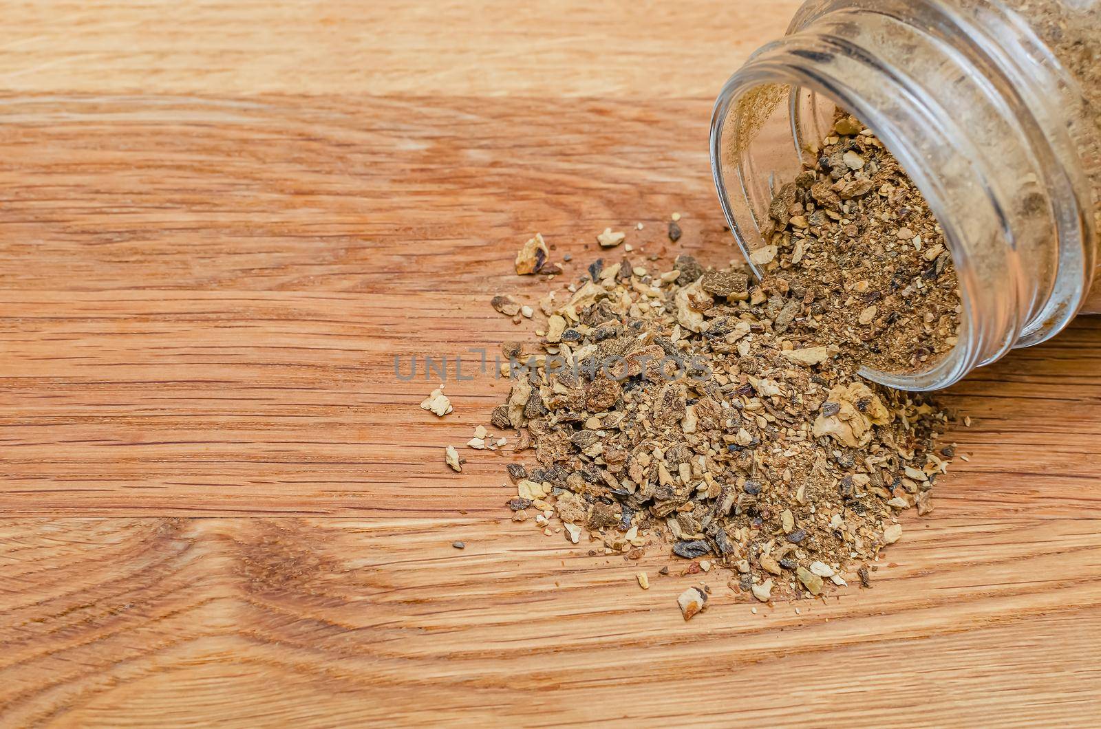 dried mushrooms on spread out on a wooden table. Chopped boletus in a container. Copy space