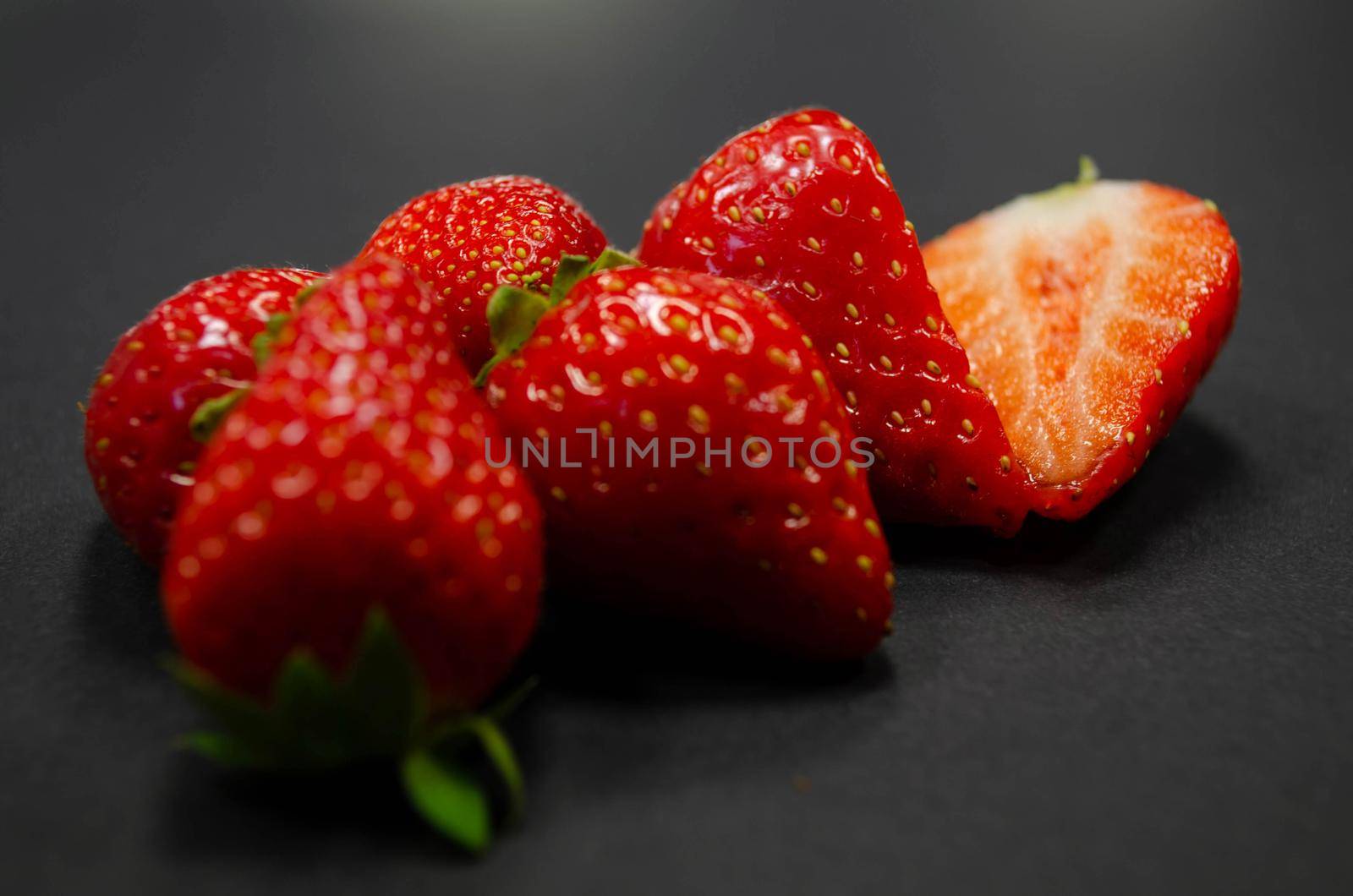 strawberries on black background