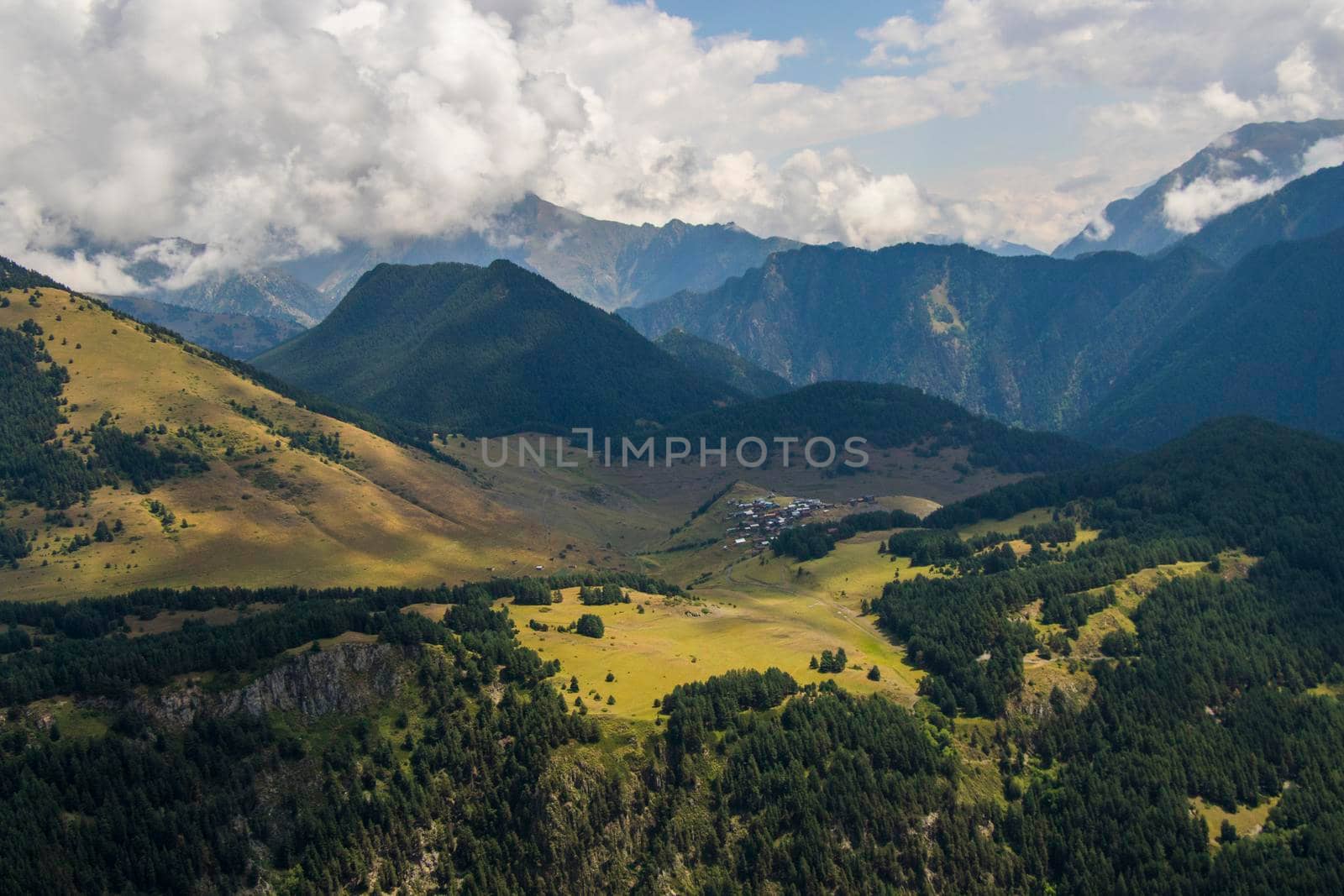 Tusheti mountain landscape and view, high angle, Georgian nature, clouds and forest
