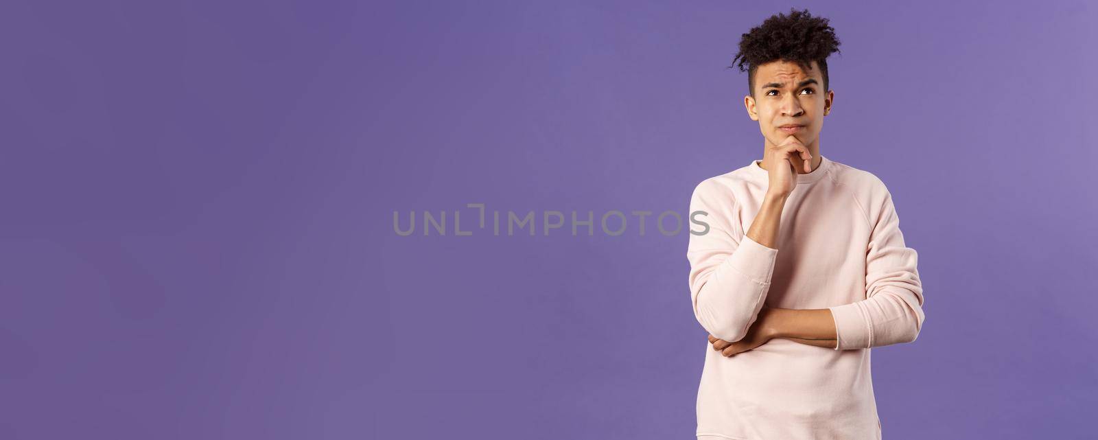 Portrait of complicated, young thoughtful man with dreads, look troubled up, thinking what to do, standing indecisive, grimacing not knowing answer, facing hard choices, purple background by Benzoix