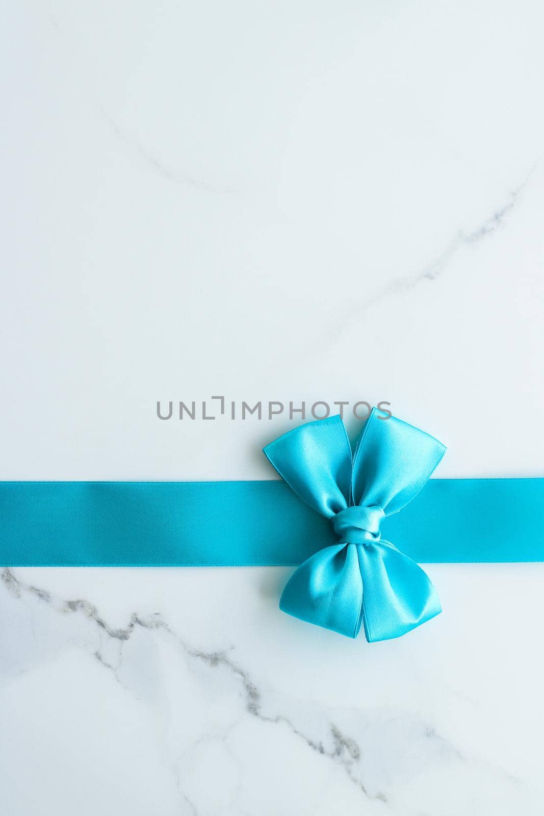 Holiday decor, feminine design and flatlay concept - Blue silk ribbon on marble, top view