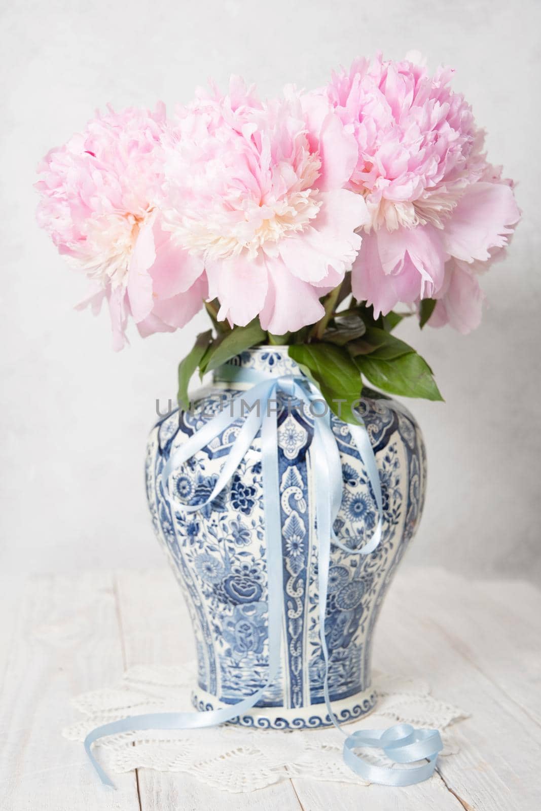 pink luxurious peonies in an ancient Chinese vase with blue ornament, springtime by KaterinaDalemans