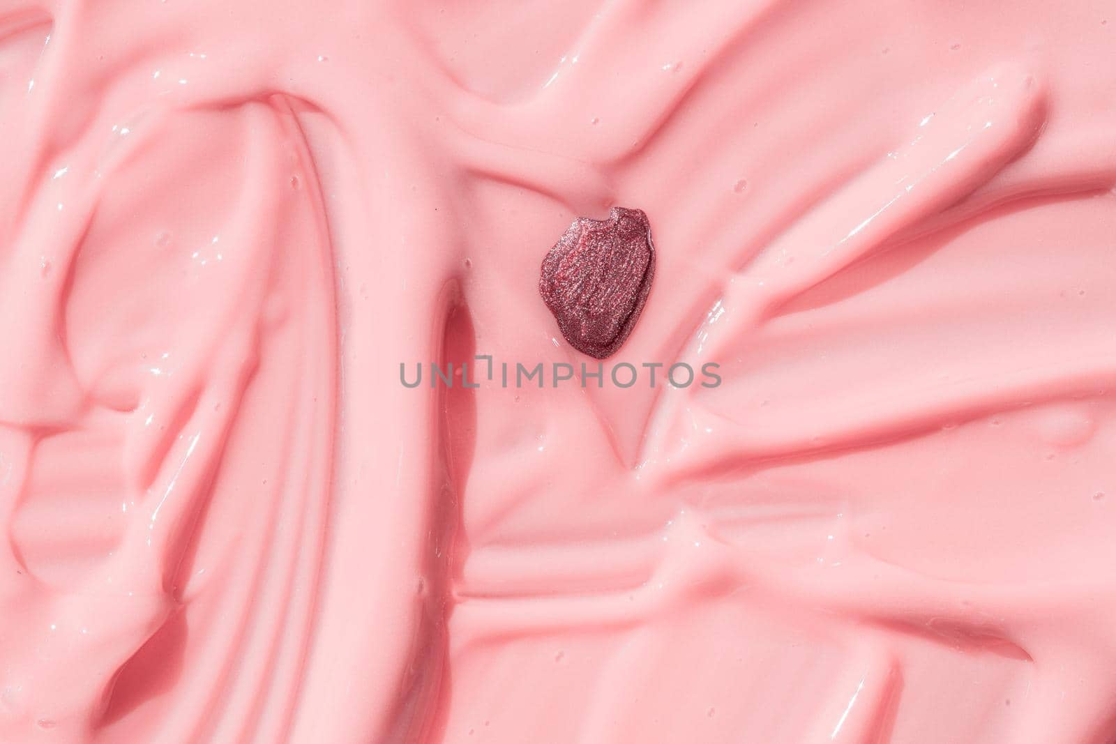 Abstract cosmetic textured background, nail polish drop on pink liquid foundation texture. Creamy skincare lotion product closeup. Moisturizing beauty creme, balm swatch, pink paint, yogurt texture