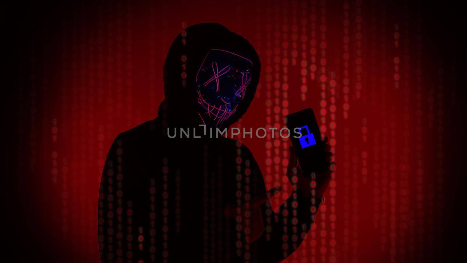 Digital security Concept. Anonymous hacker with mask holding smartphone hacked. by gnepphoto