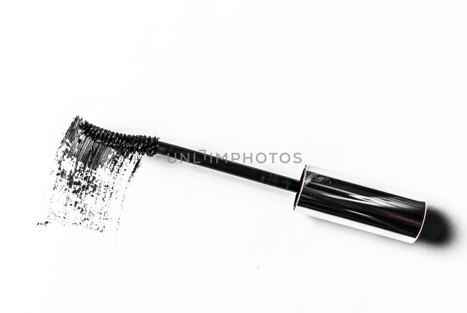 Beauty texture, cosmetic product and art of make-up concept - Black mascara brush stroke close-up isolated on white background