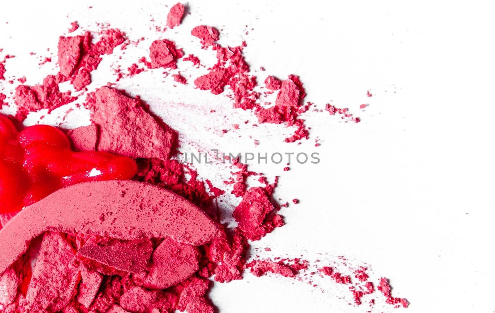 Beauty texture, cosmetic product and art of make-up concept - Crushed eyeshadows, lipstick and powder isolated on white background