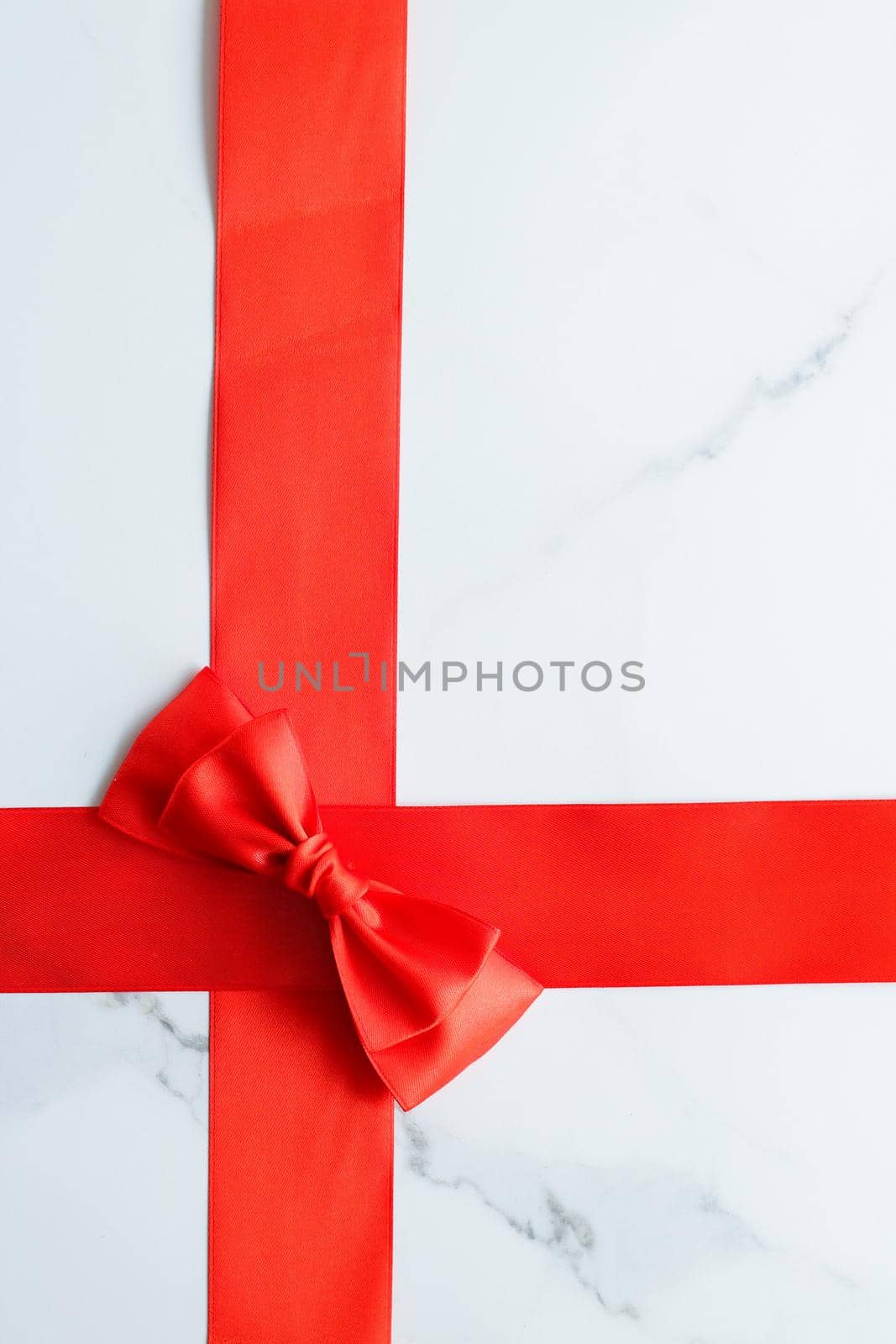 Holiday decor, feminine design and flatlay concept - Red silk ribbon on marble, top view