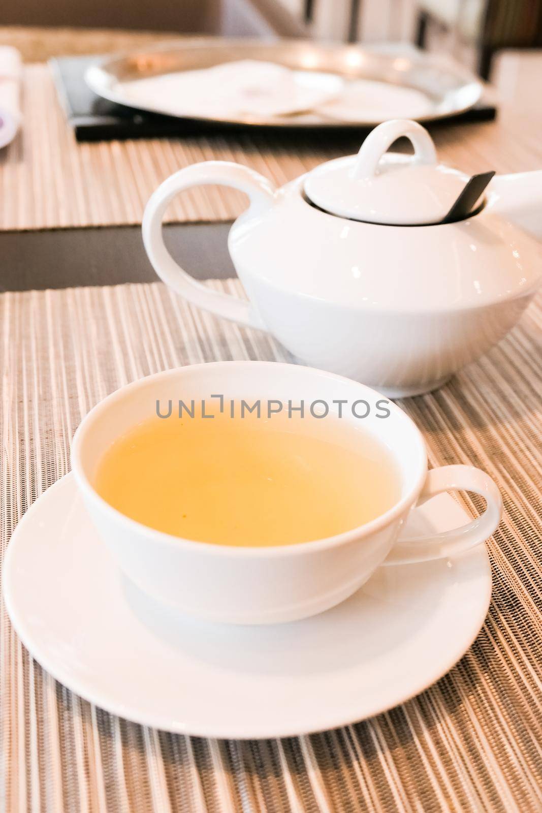 Healthy nutrition, relax and detox concept - Green herbal tea in a restaurant, five o'clock