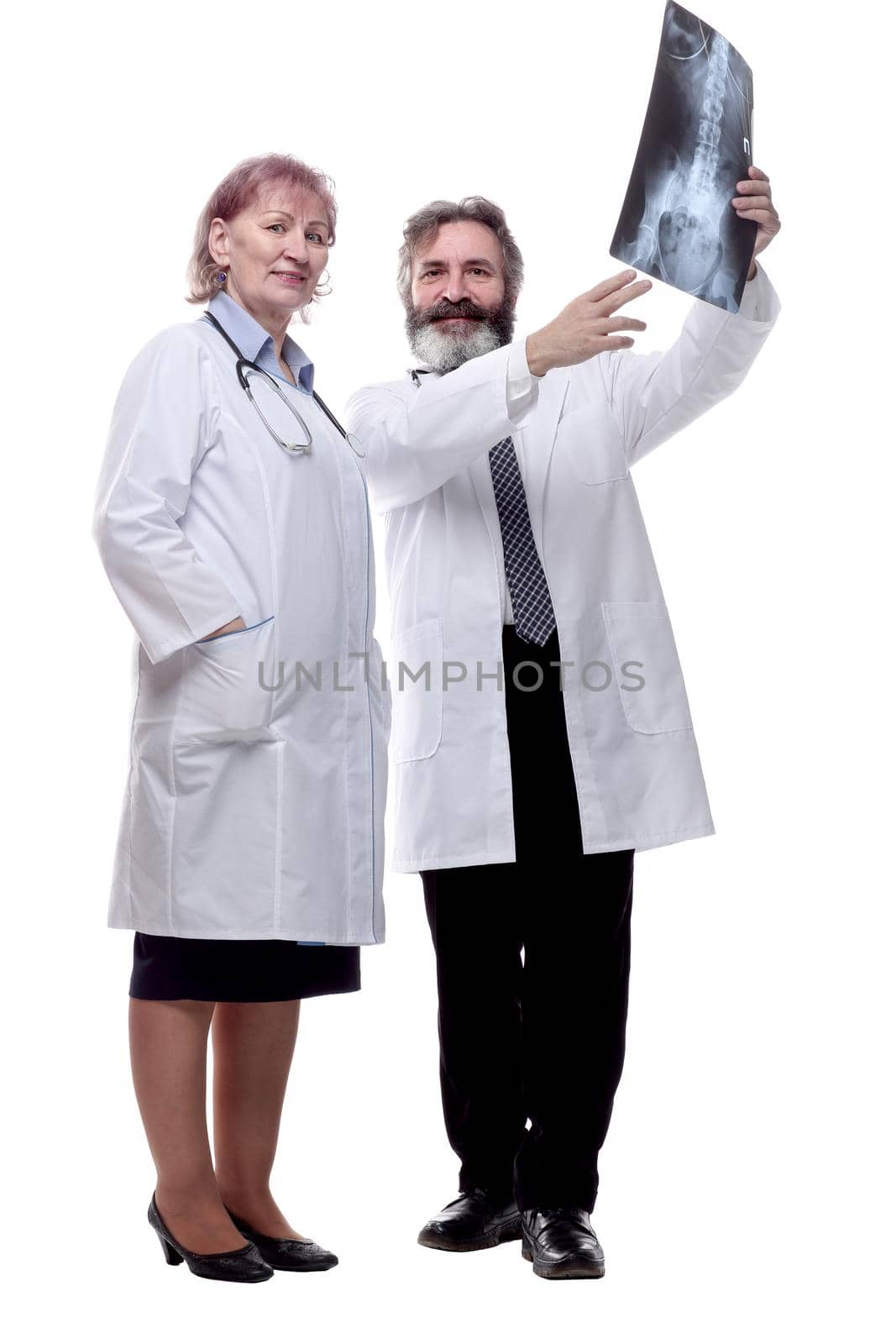 in full growth. medical colleagues discussing the x-ray . isolated on a white background