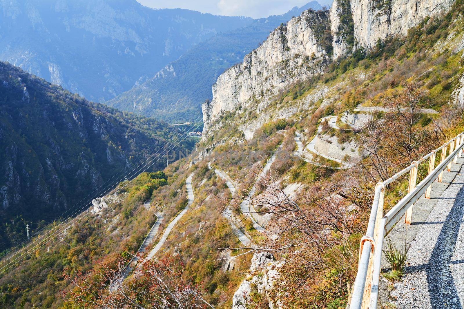 Serpentine mountain road, picturesque Alps autumn landscape. Lombardy, Italy. by photolime