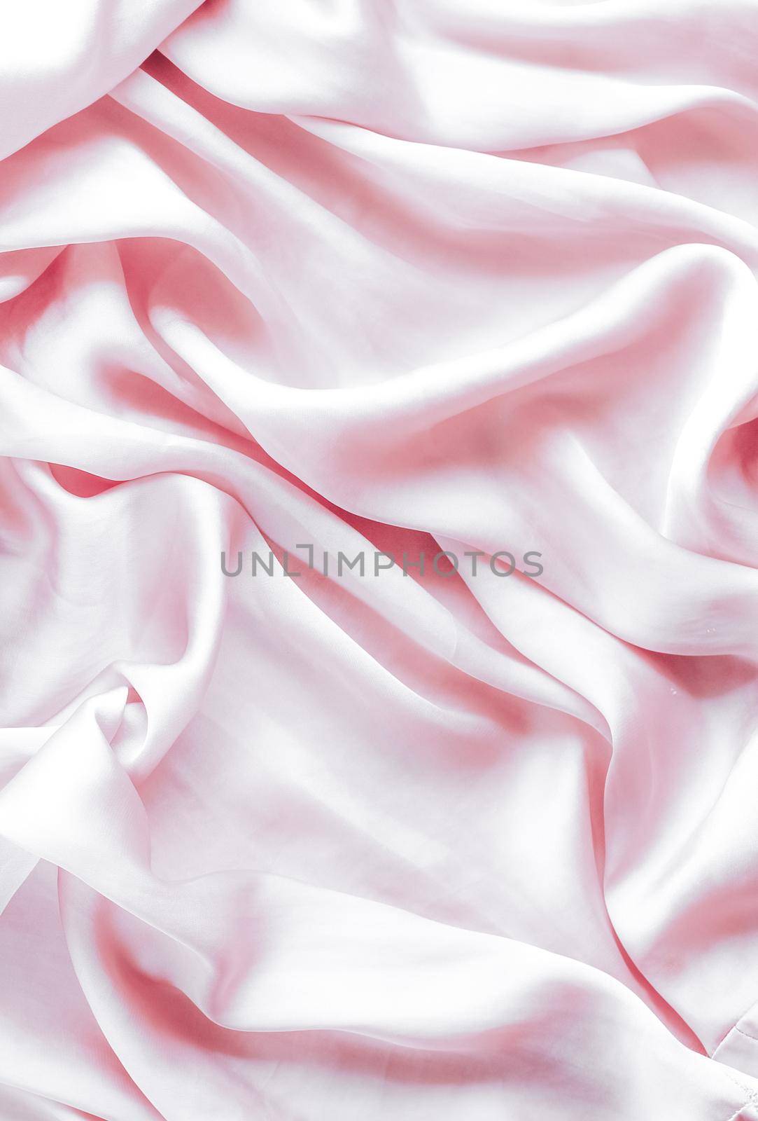 Elegant fabric texture, abstract backdrop and modern pastel colours concept - Pink soft silk waves, flatlay background