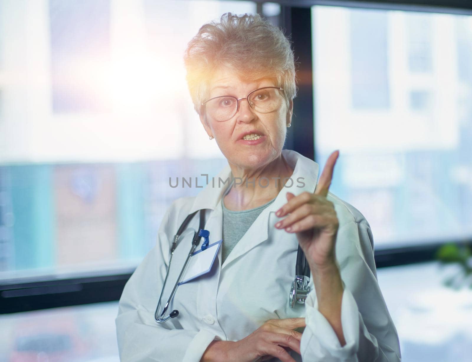 Friendly mature female doctor at hospital smiling