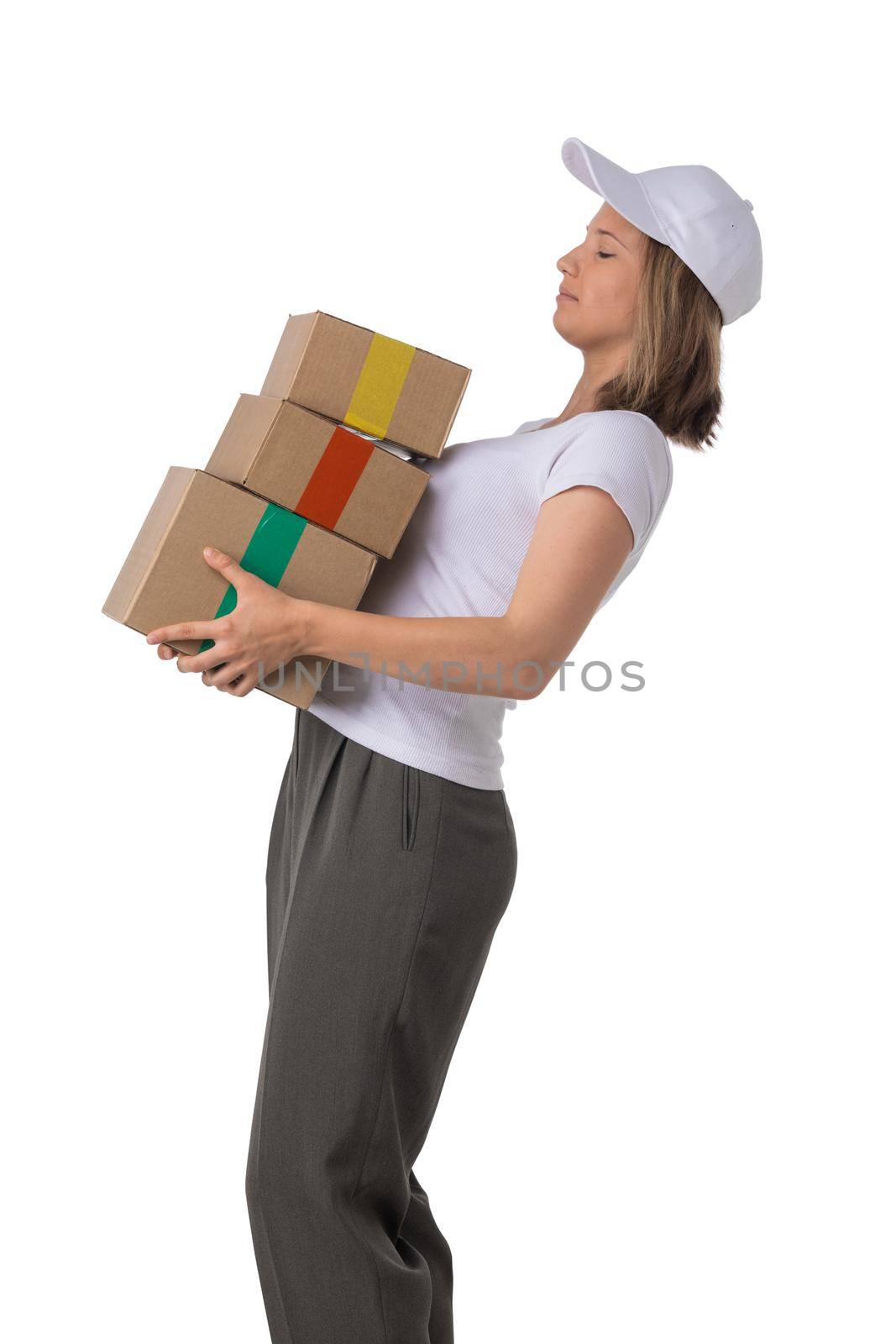 Young girl with cardboard boxes in hands isolated on white bakground, side view