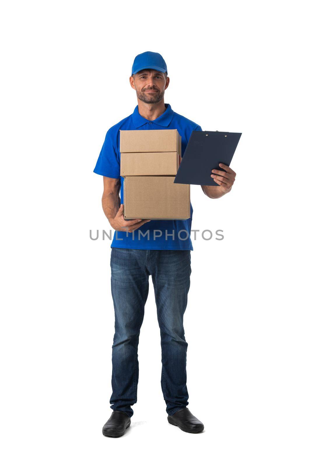 Smiling young post employee with parcels and document folder isolated on white background