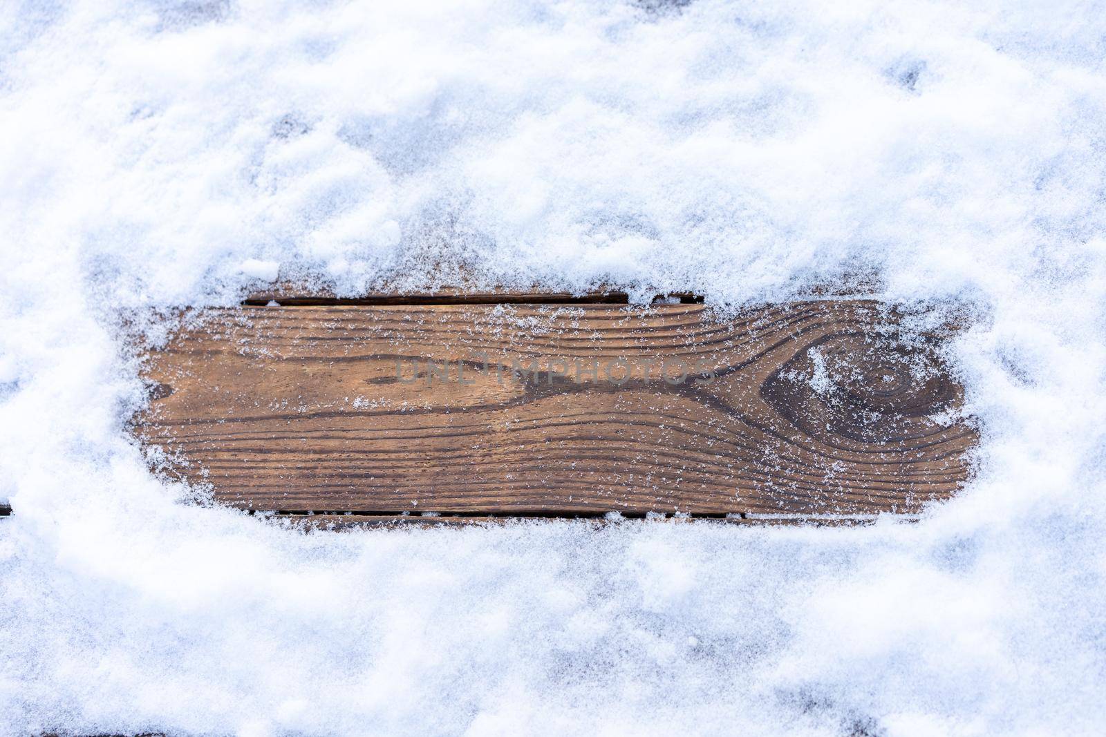 Winter background. Empty wooden plank with snow border, copy space for text by andreonegin