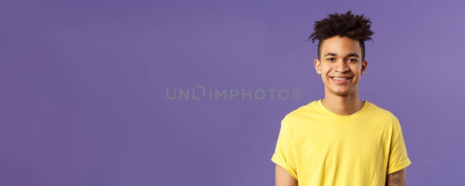 Close-up portrait of smiling, enthusiastic hispanic male student searching job, consider career opportunities, recruiting to company, smiling cheerful standing purple background by Benzoix